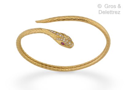 null Serpent" bracelet in yellow gold, the eyes set with rubies, the head paved with...
