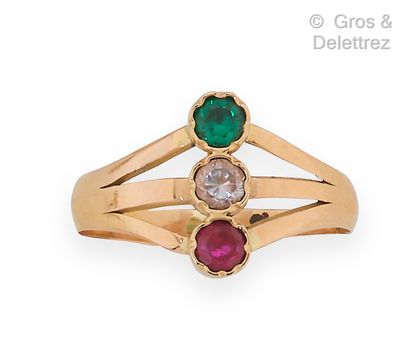null Pink gold ring, decorated with a diamond, an emerald and a ruby. Finger size...