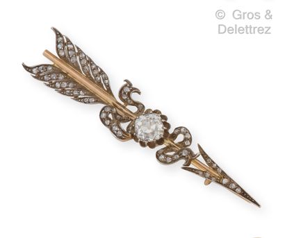 null Yellow gold and silver "Arrow" brooch, set with an old cut cushion diamond,...