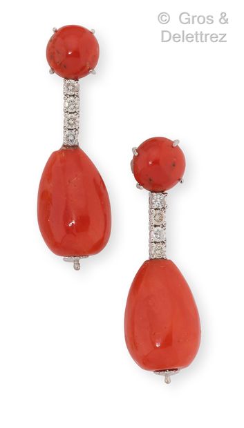 null Pair of white gold earrings, composed of a coral cabochon holding a line of...