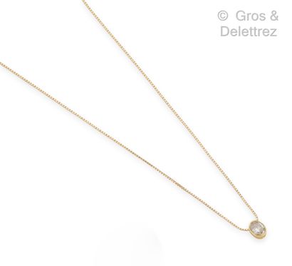 null Yellow gold (14K) pendant, decorated with an oval diamond in closed setting....