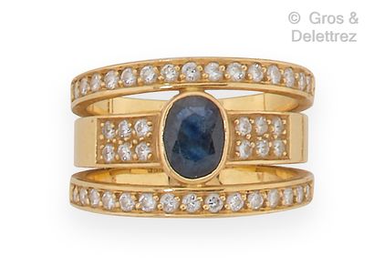null Yellow gold ring, composed of three rings decorated with a sapphire and brilliant-cut...