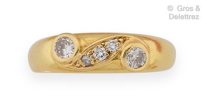 null Yellow gold "Jonc" ring, set with two brilliant-cut diamonds in a closed setting...