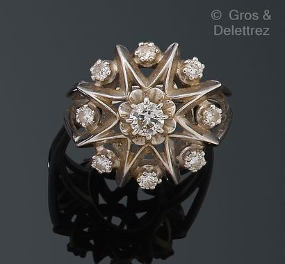 null Openwork white gold "Star" ring, punctuated with brilliant-cut diamonds, the...
