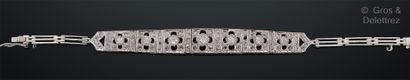 null Articulated bracelet in silver, composed of a fall of square links openwork...