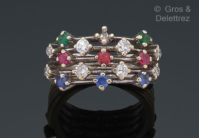 null White gold ring, composed of gold threads highlighted with rubies, emeralds,...