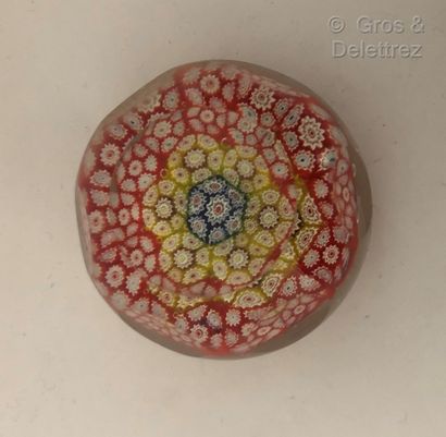 null Round faceted crystal paperweight.



Red, yellow, blue and white tinted millefiori...