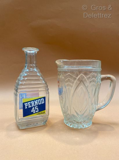 null Pernod. A decanter and a glass pitcher, one marked Pernod 45 and the other Un...