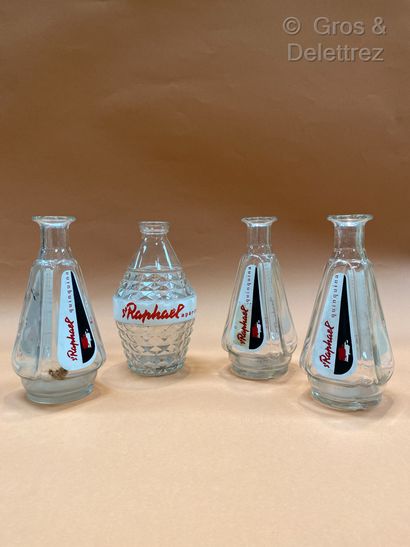 null Saint Raphael. Four glass decanters, one with diamond points, the others fa...