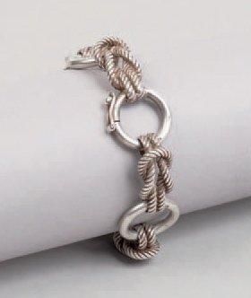 HERMÈS Paris Bracelet «Audierne» en argent à décor de noeuds tréssés et d'anneaux,...