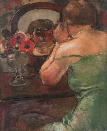 Georges CAPON (1890-1980) Femme au miroir Huile sur toile, signée en bas à gauche....