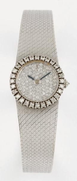 CORUM N° 164847 VERS 1960 Montre bracelet de dame en or blanc. Boîtier rond, lunette...