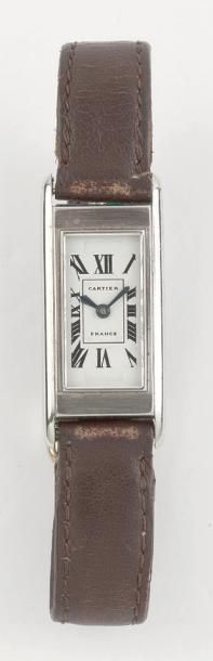 CARTIER DUOPLAN VERS 1930 Montre bracelet de dame en acier. Boîtier rectangle. Cadran...