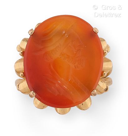 null Yellow gold ring set with a carnelian intaglio engraved with a helmeted bust....