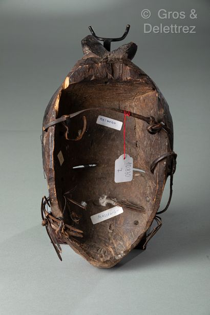 null Object: Mask

Ethnic group: Massengo

Description: Mask with a cap and two small...