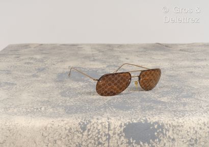 GUCCI - Pair of sunglasses in gilded metal,...