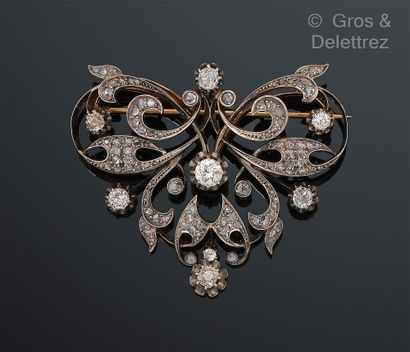 Yellow gold and silver openwork brooch decorated...