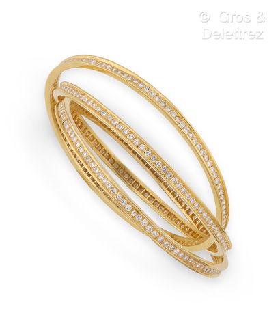 null Yellow gold bracelet, composed of three interlaced rings, entirely set with...