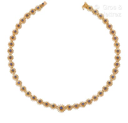 BOUCHERON Flexible yellow gold necklace, articulated with flowers composed of gold...