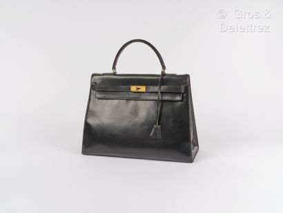 HERMES Paris Kelly Sellier" bag 36 cm in black box, gold plated fasteners and clasp,...