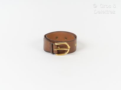 HERMES Paris Brown patinated leather belt with gold metal eyelets, coordinated buckle....