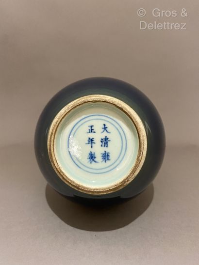 null China. A long-necked ovoid porcelain bottle vase with sapphire enamel and ringed...