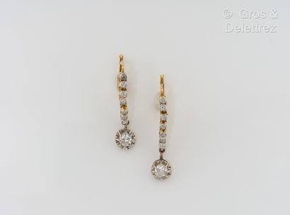 null Pair of yellow gold earrings adorned with a fall of old cut diamonds holding...