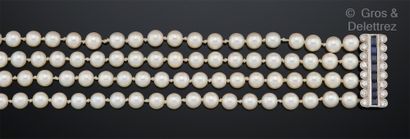 null Bracelet composed of four rows of white cultured pearls. The clasp in white...
