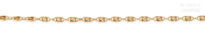 null Yellow gold watch chain forming a necklace, the oval links composed of interlacing....