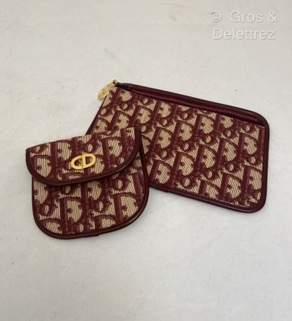 null CHRISTIAN DIOR Lot composé d'un porte monnaie et d'une pochette zippée en toile...