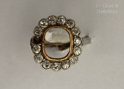null Two damaged gold ring settings. One in white gold, set with old-cut diamonds...
