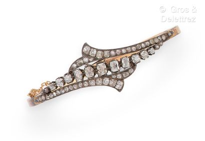 null Yellow gold and silver "Jonc" bracelet, decorated with stylized palmettes set...