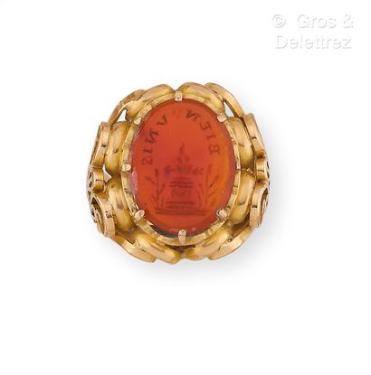 null Yellow gold ring with chased scroll design, decorated with an intaglio engraved...