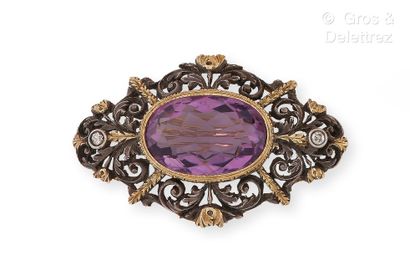 null Silver and vermeil brooch openwork of foliage, topped with a large oval amethyst....