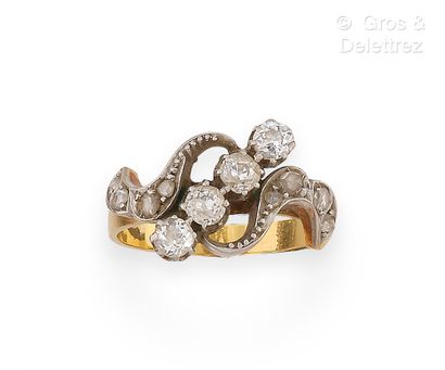 null Yellow gold and platinum "Volutes" ring, set with a line of old-cut diamonds...