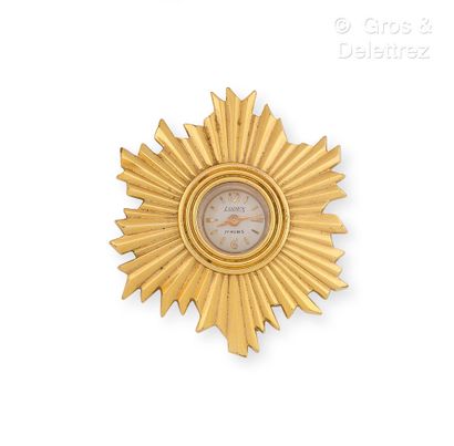 null Metal brooch-pendant, featuring a radiant motif holding a LODEX mechanical watch,...