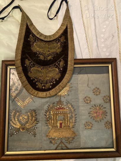 null Freemasonry 
Element of apron in blue silk with gold embroidery of masonic motifs...