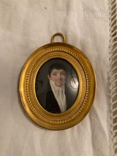 null Miniature 
French school circa 1810 
Portrait of a smiling man 
Oval gouache...