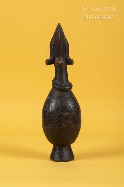 TCHAD Reliquary in patinated wood in the shape of a bottle topped by a female head,...