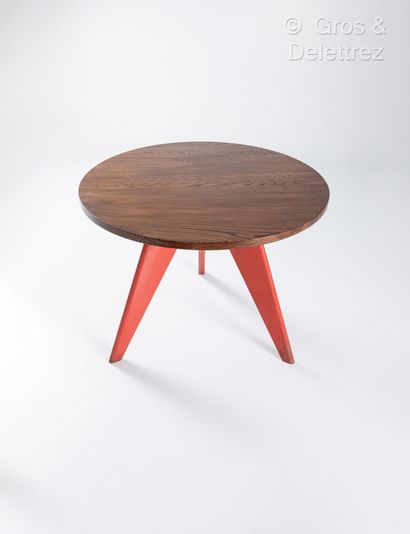null Jean PROUVE (1901-1984)
Table, circular oak top, tripod base in red lacquered...