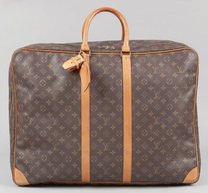 Louis VUITTON Valise "Sirius" 58 cm en toile monogram et cuir naturel, fermeture...