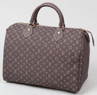 Louis VUITTON Sac "Speedy" 30 cm en tissus monogram marron et cuir marron grené,...