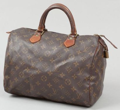 Louis VUITTON Sac "Speedy" 30 cm en toile monogram et cuir naturel, fermeture éclair,...