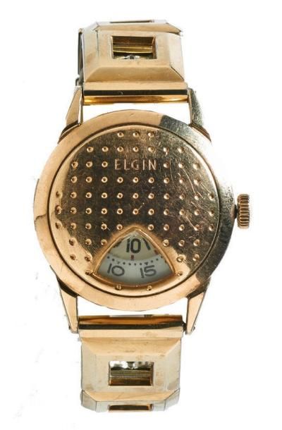 ELGIN Vers 1940 Montre bracelet en métal plaqué or. Boîtier rond. Lecture des heures...
