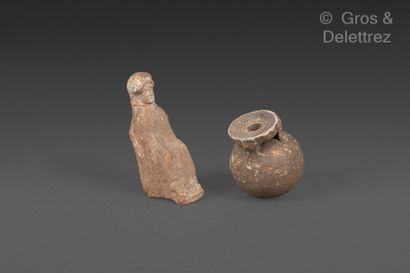 null Lot including a triple-handled aryball, a seated peplophore figurine, arms at...
