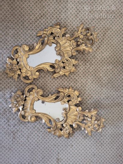 null Pair of carved, openwork and gilded wood mirrors decorated with large scrolls...