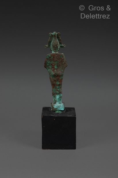 null Statuette of Osiris standing, holding scepter and flagellum. He is crowned with...