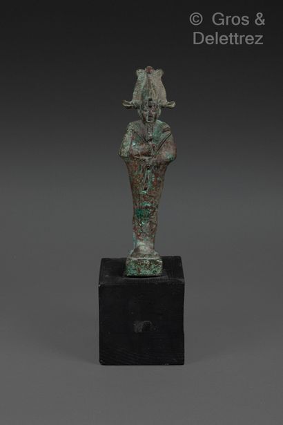 null Statuette of Osiris standing, holding scepter and flagellum. He is crowned with...