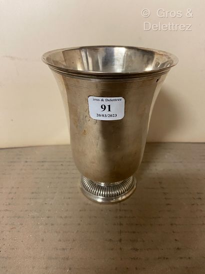 null Silver tulip tumbler on a gadrooned pedestal. The neck is underlined with fillets.
Paris...