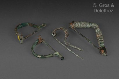 null Set of five fibulae, one with a ringed bow, one with a navicella and two with...